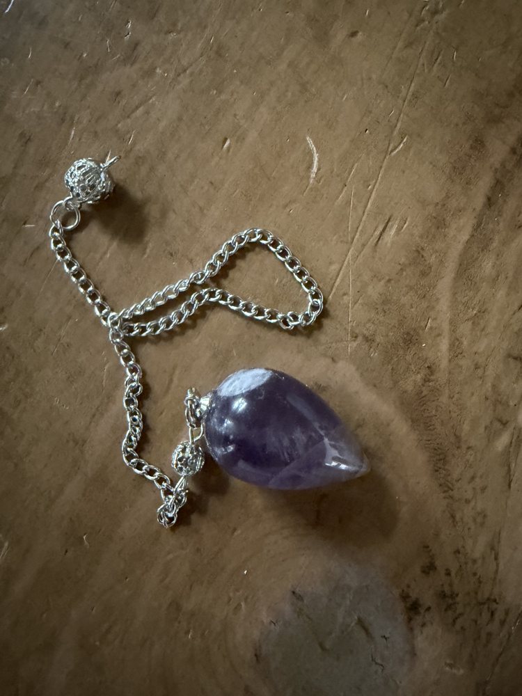 Crystal pendulum on a silver chain